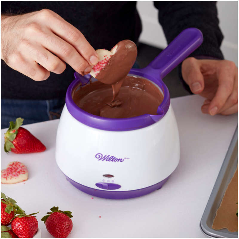 Dipping Cookies in Candy Melting Pot image number 4