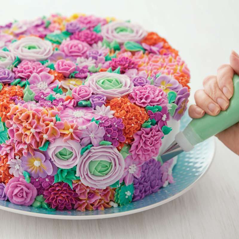 Decorating a Colorful Floral Cake image number 4