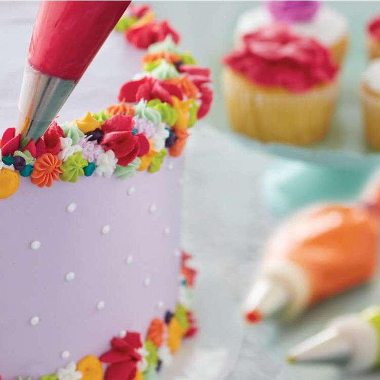 Piping Buttercream Flowers on a Purple Cake