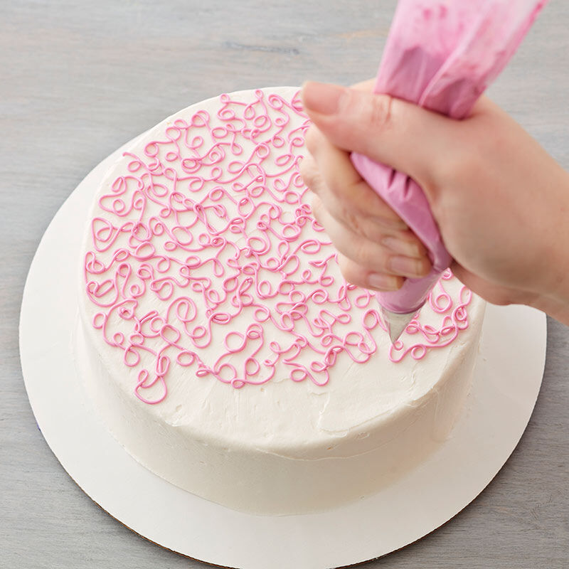 Sotas technique piped on the top of a round cake image number 2